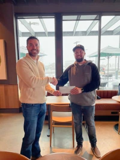 personal injury lawyer client getting check in denver