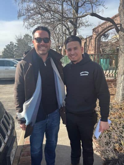 personal injury victim getting check from Brendan McQuaid (2)