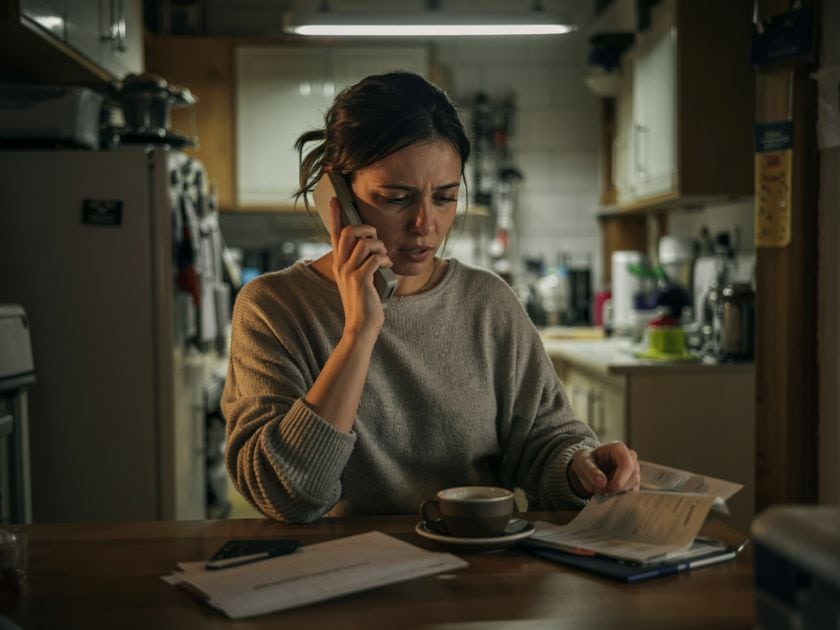woman on the phone with her car insurance company