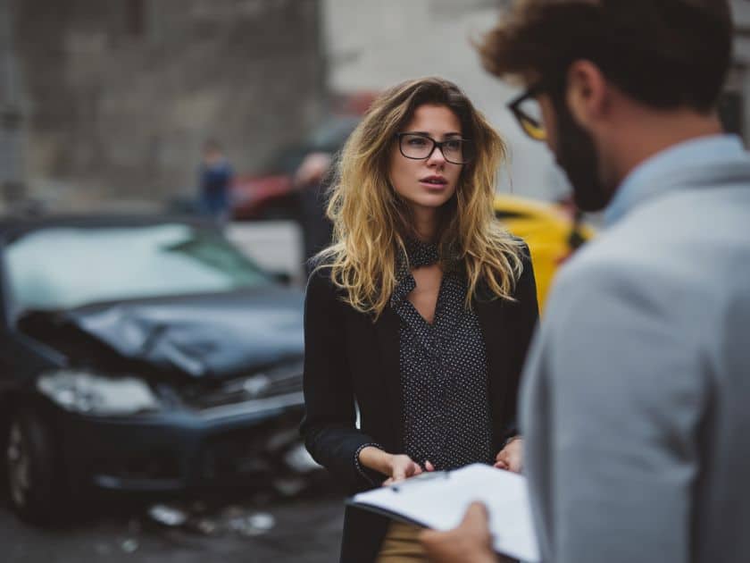 woman talking to insurance adjuster