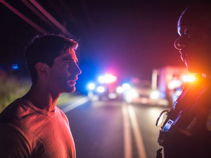 a man speaking to police officer