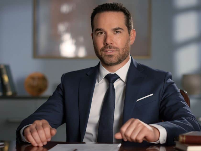 personal injury lawyer brendan McQuaid sitting in a desk.